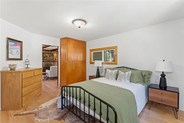 a bedroom with a bed and a dresser