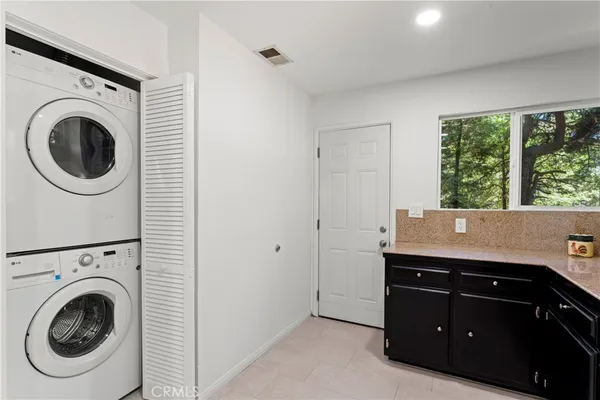 a view of a room with washer and dryer