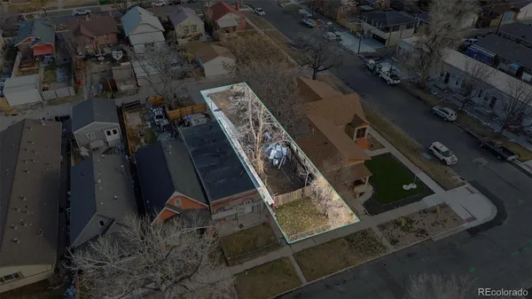 an aerial view of a residential houses with outdoor space