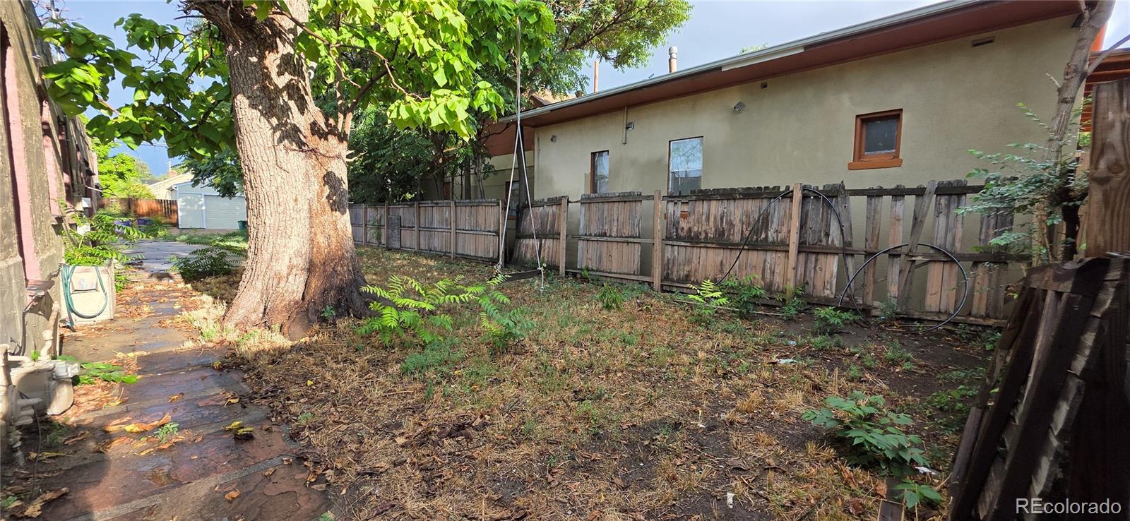 3510 High Street Denver, CO 80205 - Photo 2 of 12 a backyard of a house with lots of green space