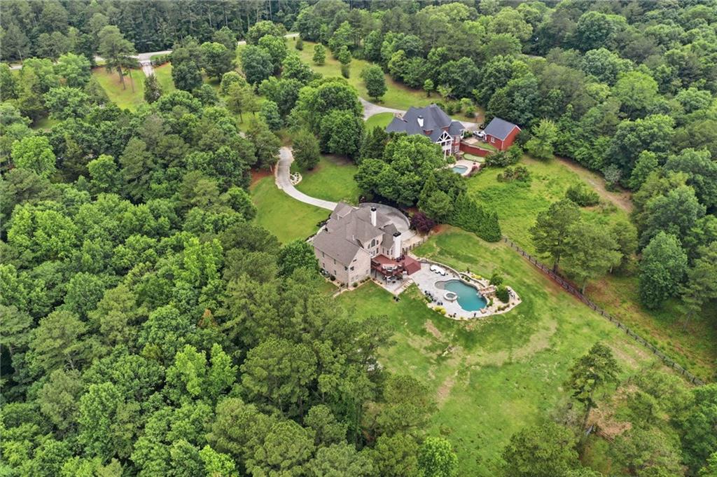 2950 Callie Still Road Lawrenceville, GA 30045 - Photo 62 of 77 an aerial view of residential house with outdoor space and trees all around