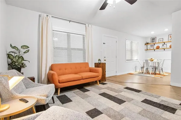 a living room with furniture and a large window