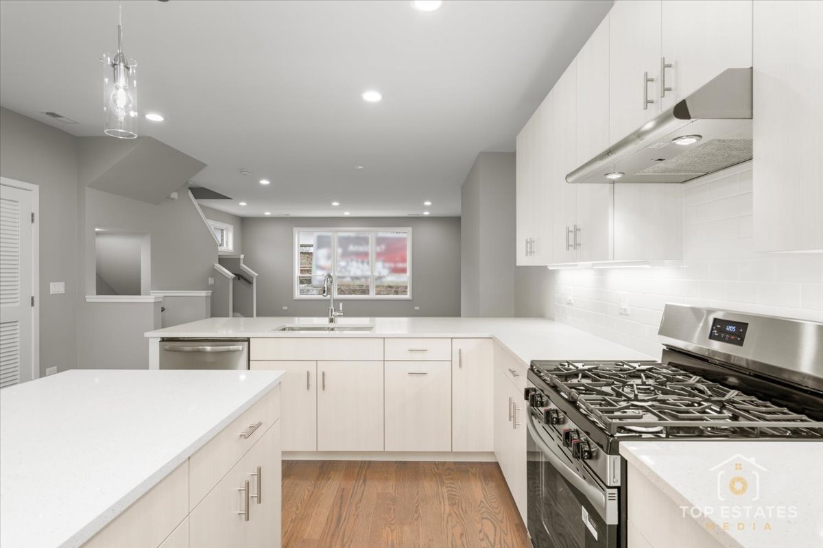 3638 South Western Avenue, Unit F Chicago, IL 60632 - Photo 18 of 36 a kitchen with a stove a sink and a refrigerator