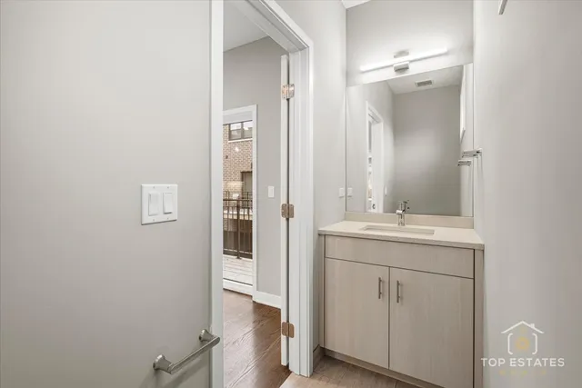 a bathroom with a sink and mirror