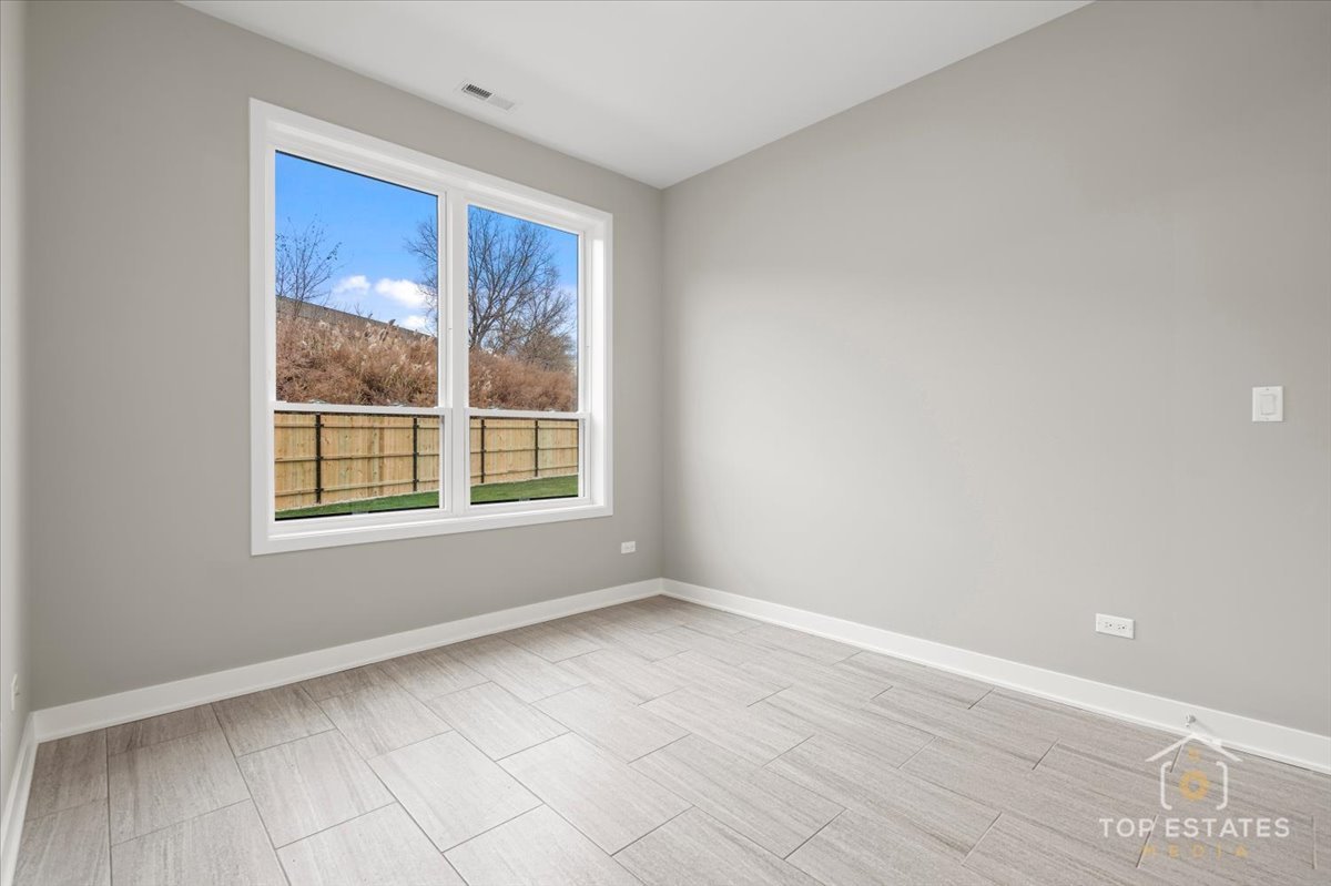 3638 South Western Avenue, Unit F Chicago, IL 60632 - Photo 7 of 36 a view of an empty room with a window