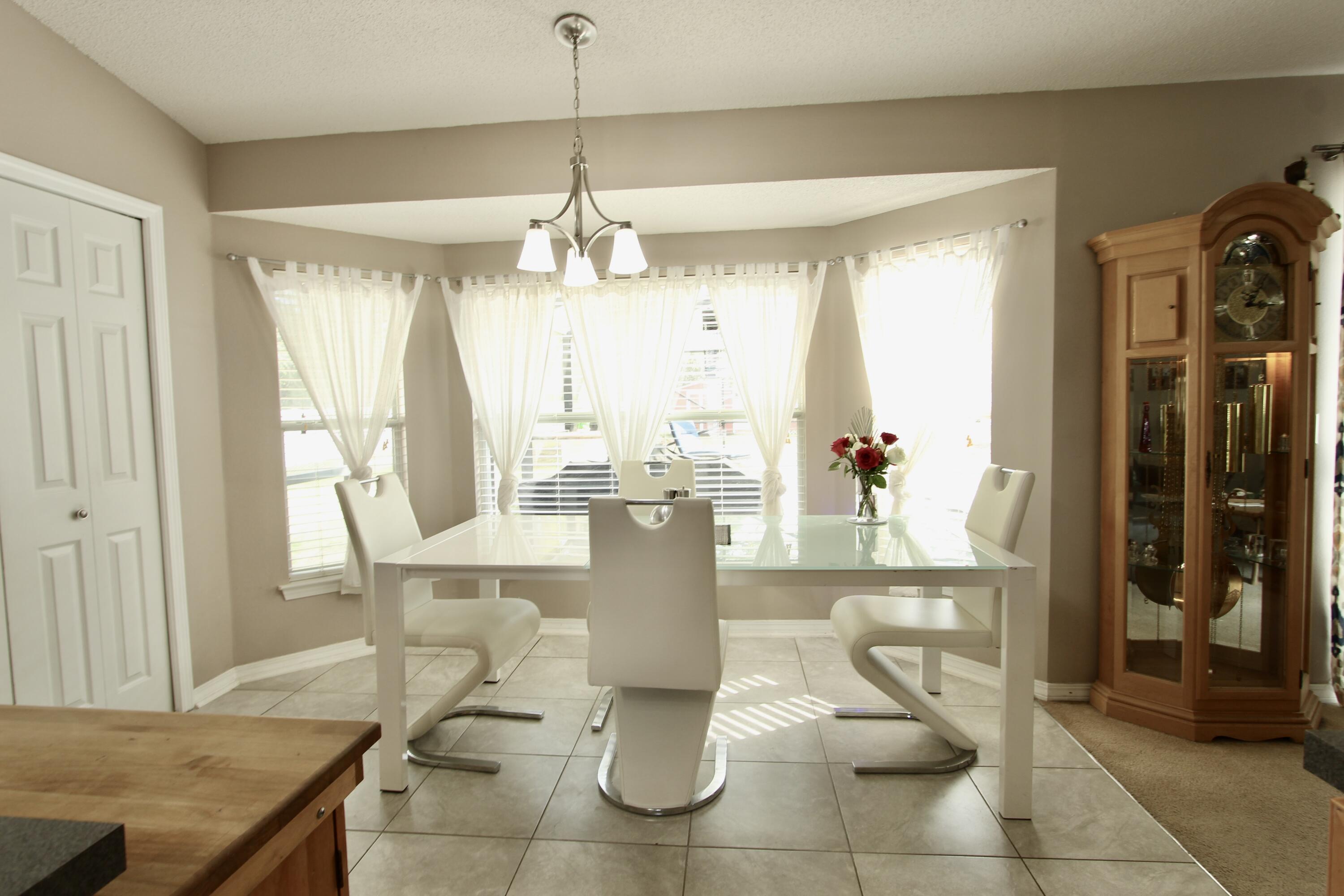 7183 Riverview Road Navarre, FL 32566 - Photo 11 of 39 a view of a dining room with furniture window and outside view