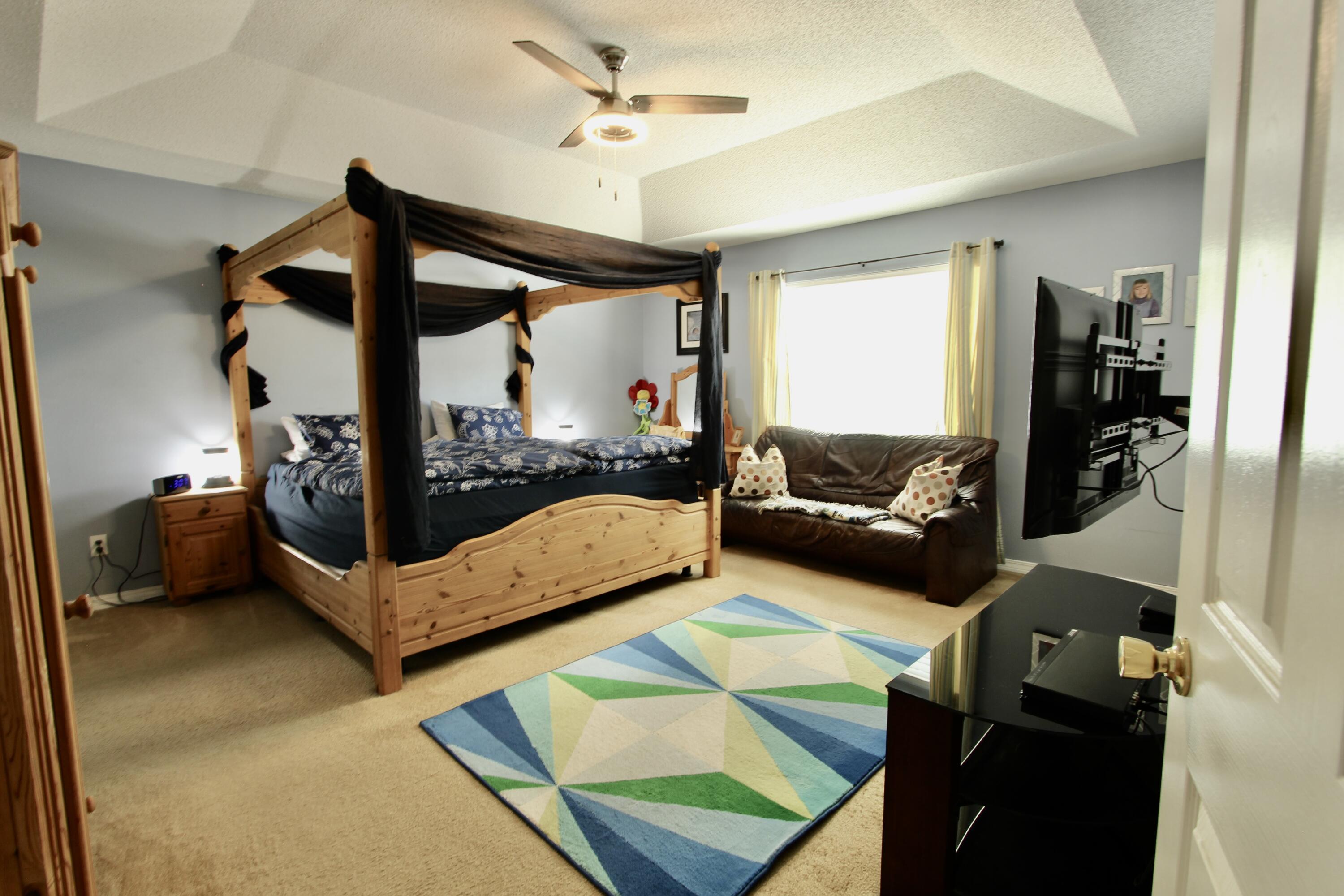 7183 Riverview Road Navarre, FL 32566 - Photo 16 of 39 a bed room with furniture and a window