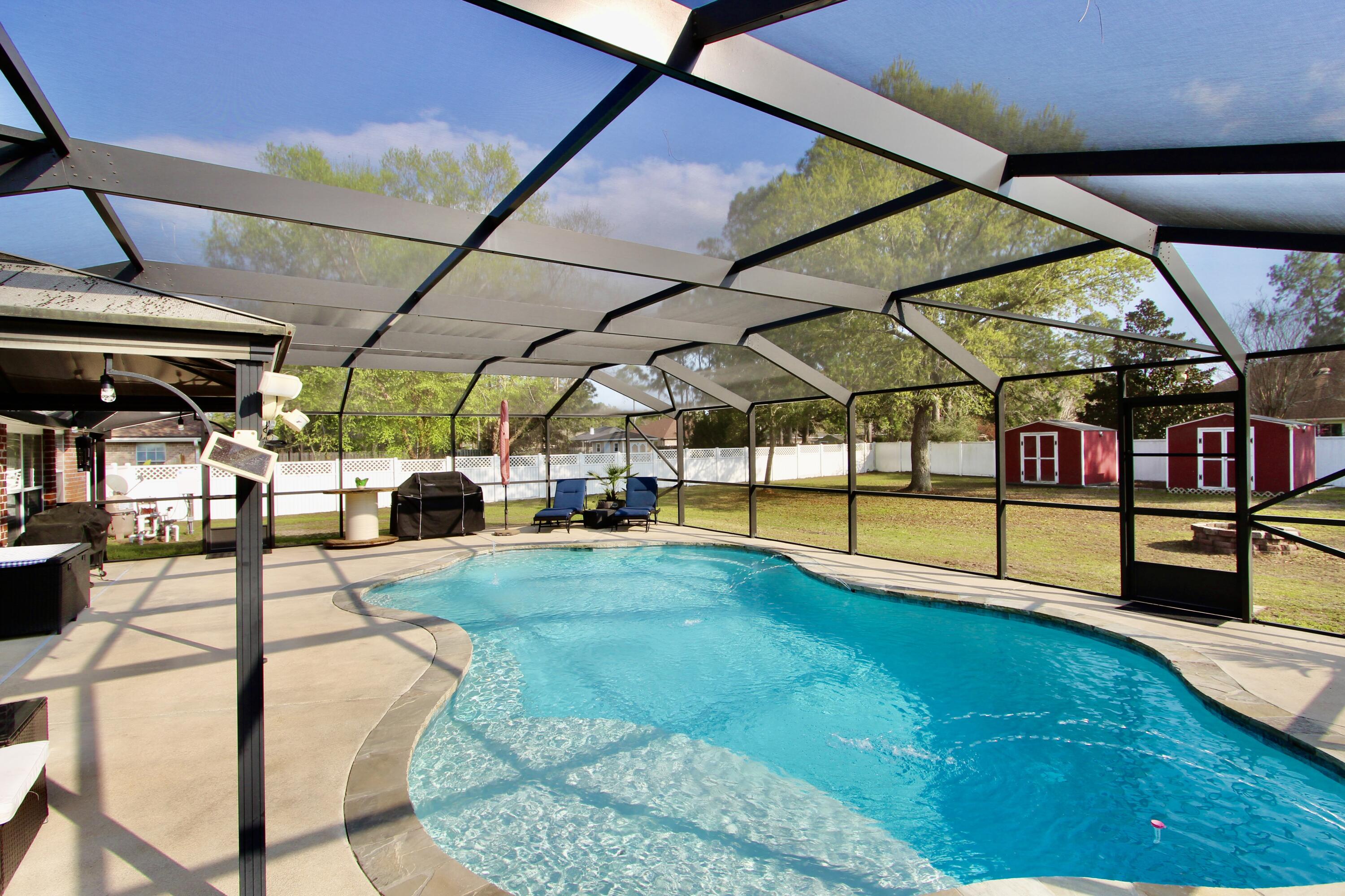 7183 Riverview Road Navarre, FL 32566 - Photo 31 of 39 a view of yard with patio