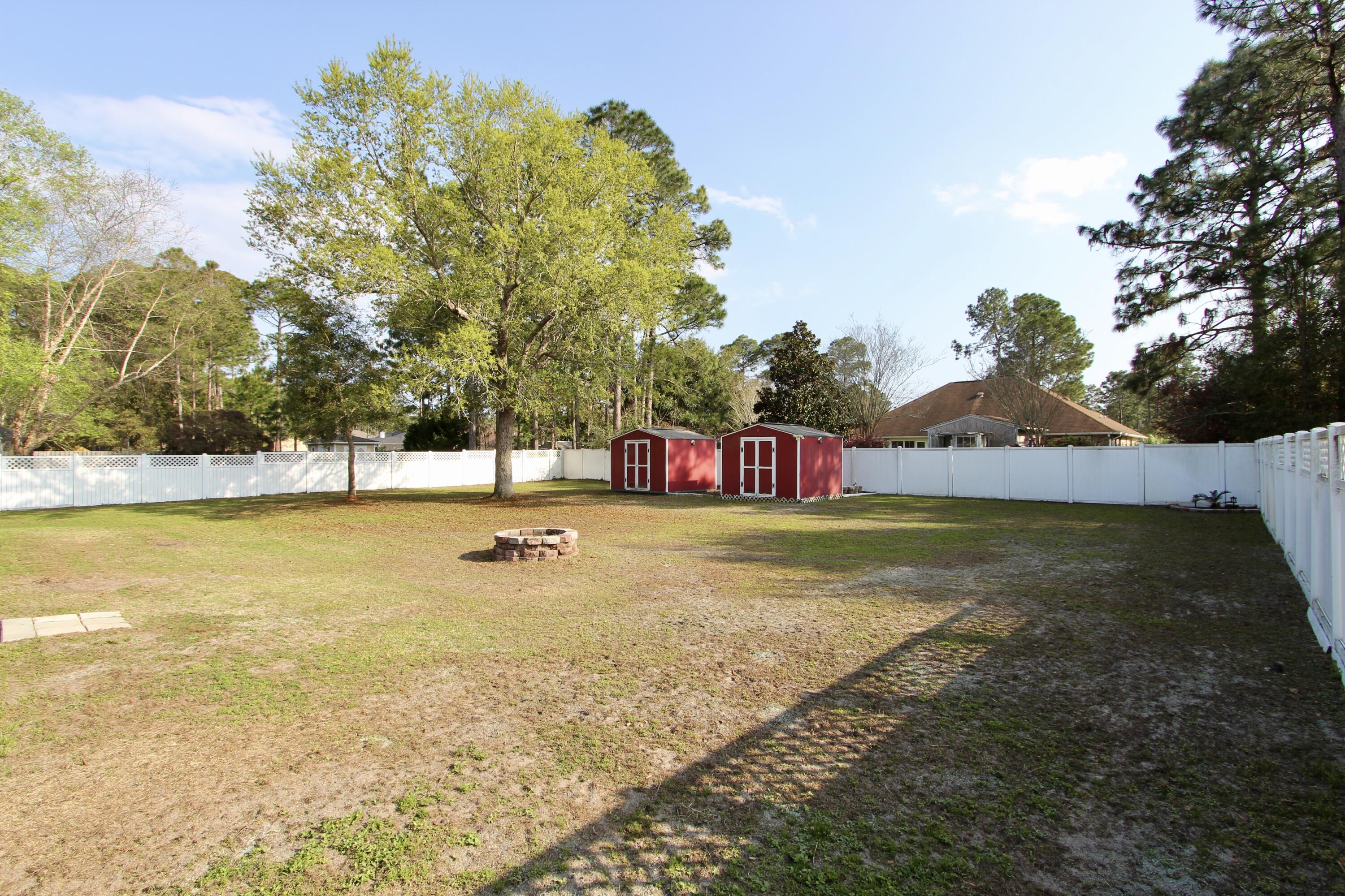 7183 Riverview Road Navarre, FL 32566 - Photo 33 of 39 a view of swimming pool with trees and lake view