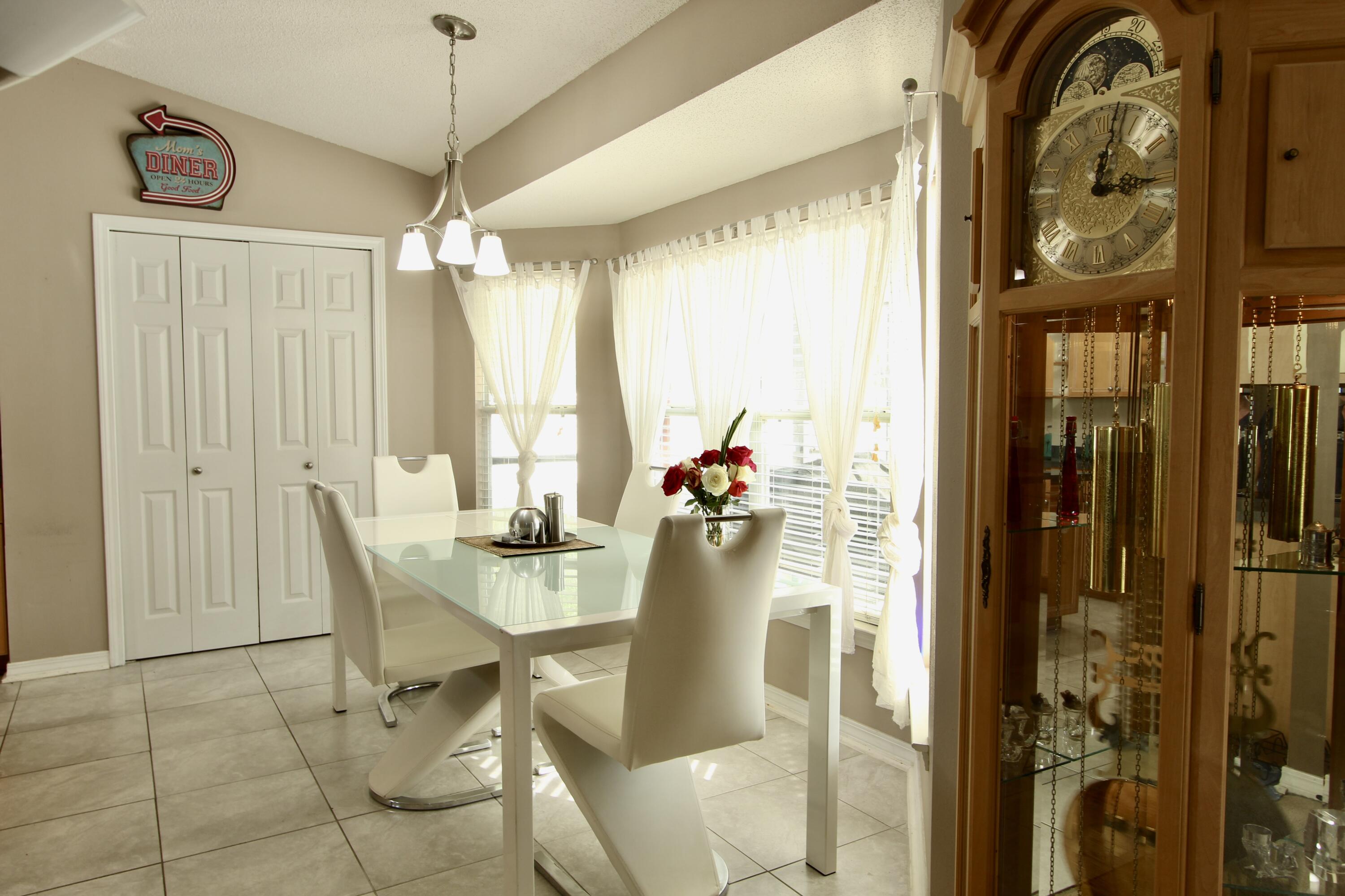 7183 Riverview Road Navarre, FL 32566 - Photo 10 of 39 a view of a dining room with furniture window and outside view