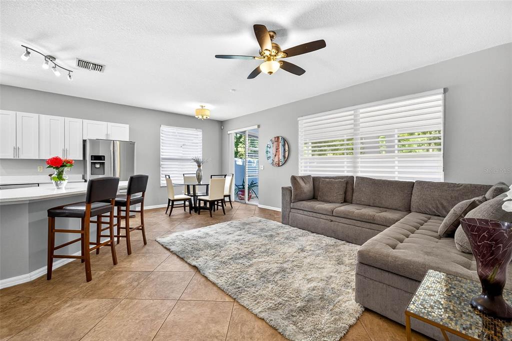 8853 Cypress Hammock Drive Tampa, FL 33614 - Photo 11 of 41 a living room with furniture and a large window