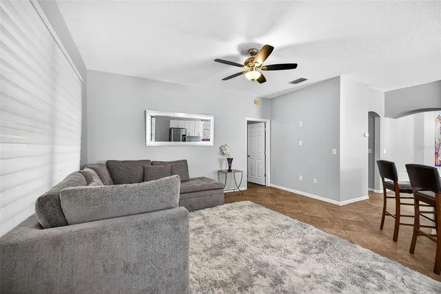 a living room with a couch and a window