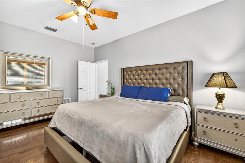 8853 Cypress Hammock Drive Tampa, FL 33614 - Photo 19 of 41 a bedroom with a bed and a dresser