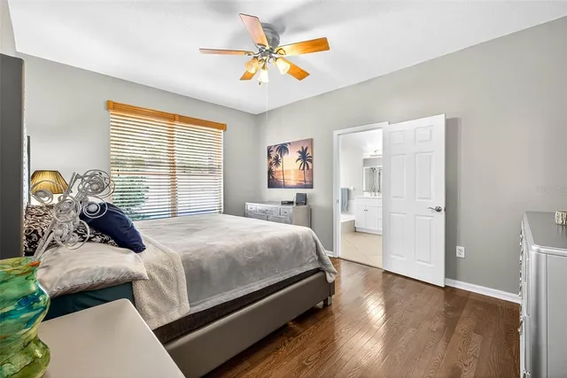 a bathroom with a sink a mirror a vanity and bathtub