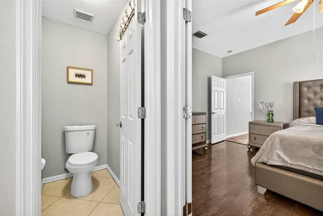 a view of a hallway with closet and a livingroom view