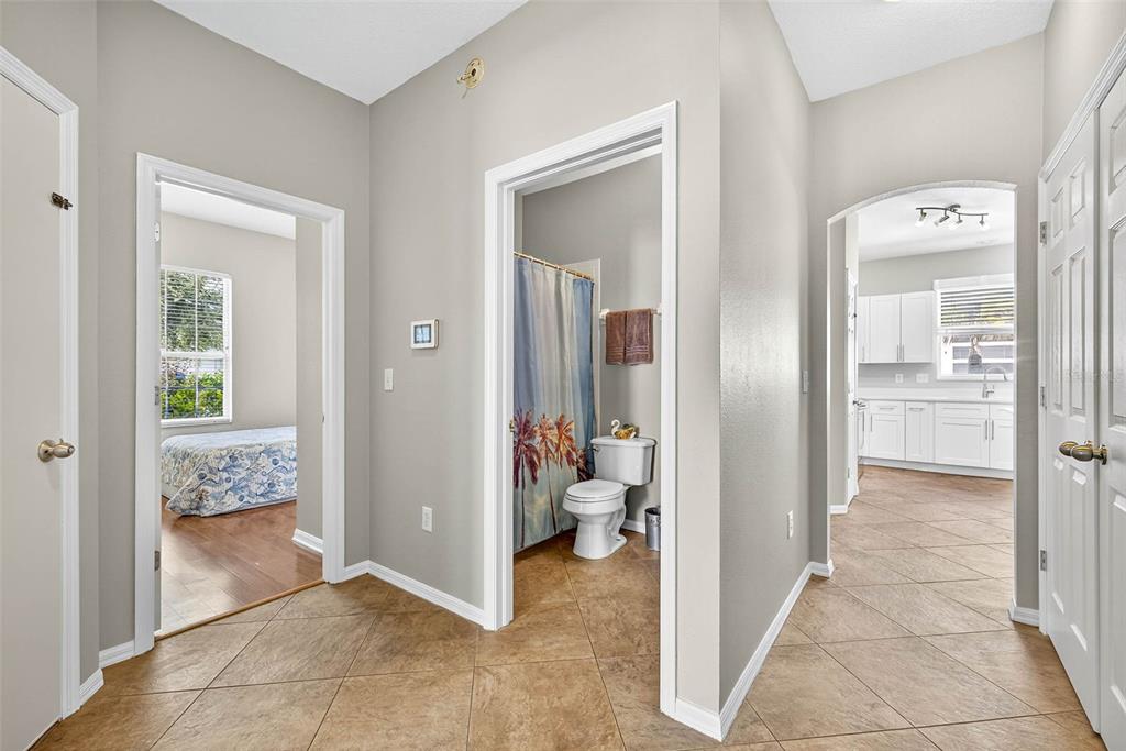 8853 Cypress Hammock Drive Tampa, FL 33614 - Photo 26 of 41 a view of a hallway with closet and a livingroom view