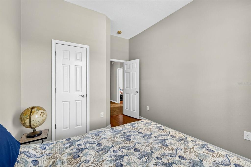 8853 Cypress Hammock Drive Tampa, FL 33614 - Photo 30 of 41 a bedroom with bed and mirror