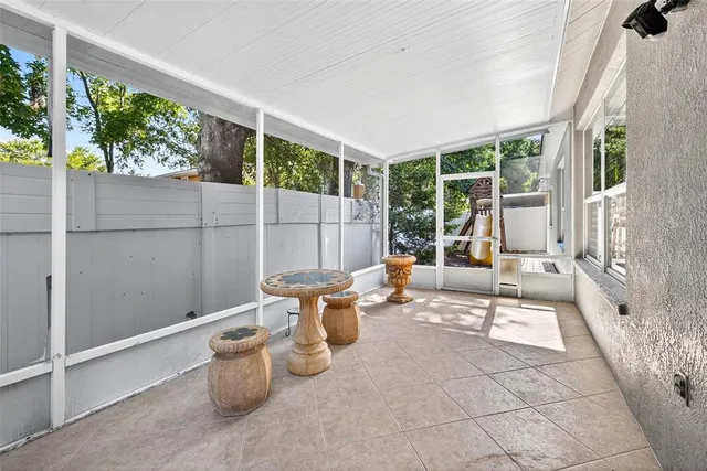a view of a patio with table and chairs