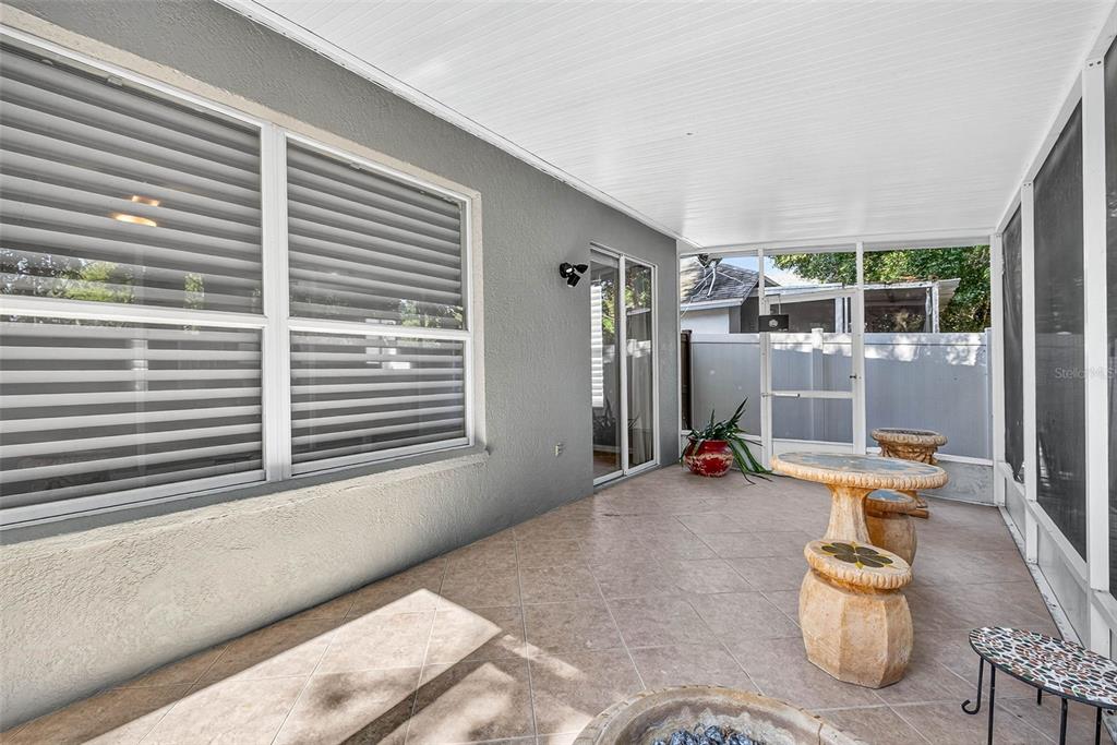 8853 Cypress Hammock Drive Tampa, FL 33614 - Photo 34 of 41 a view of a patio with table and chairs