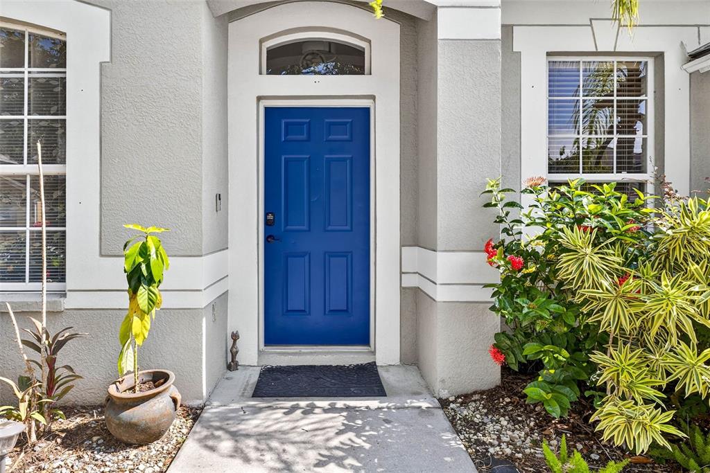 8853 Cypress Hammock Drive Tampa, FL 33614 - Photo 4 of 41 a front view of a house with a garden