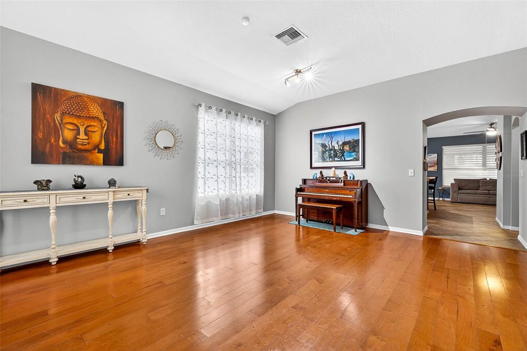 8853 Cypress Hammock Drive Tampa, FL 33614 - Photo 8 of 41 a view of an empty room with window and wooden floor