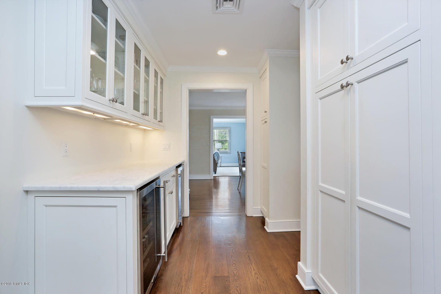 58 Indian Head Road Riverside, CT 06878 - Photo 13 of 33 a view of a hallway with wooden floor and staircase