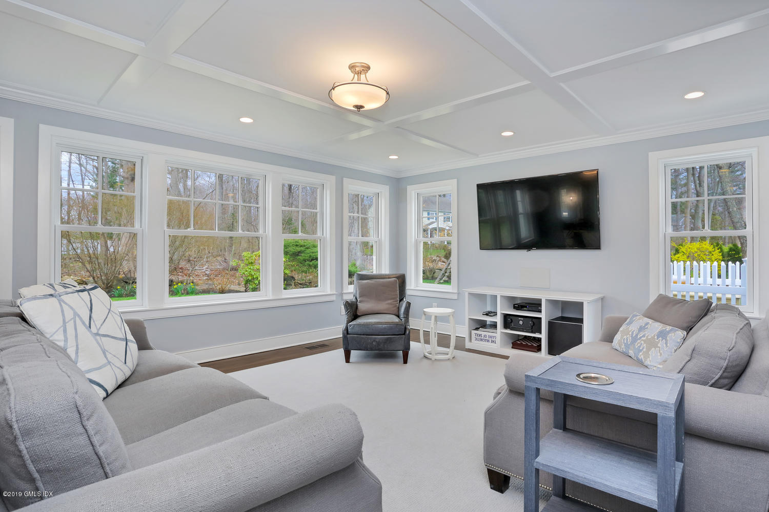 58 Indian Head Road Riverside, CT 06878 - Photo 14 of 33 a living room with furniture tv and a large window