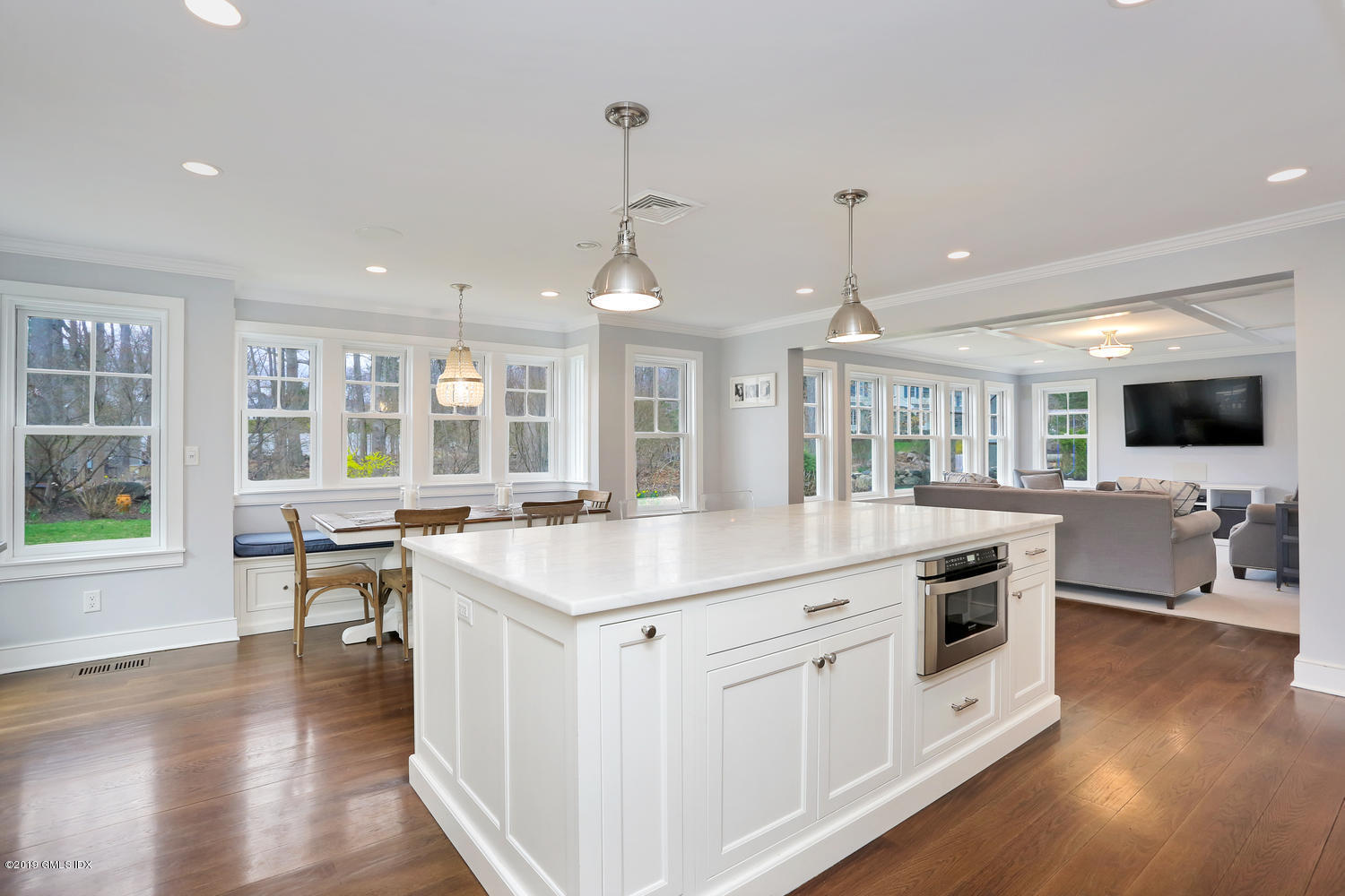 58 Indian Head Road Riverside, CT 06878 - Photo 2 of 33 a kitchen with a stove and a wooden floor
