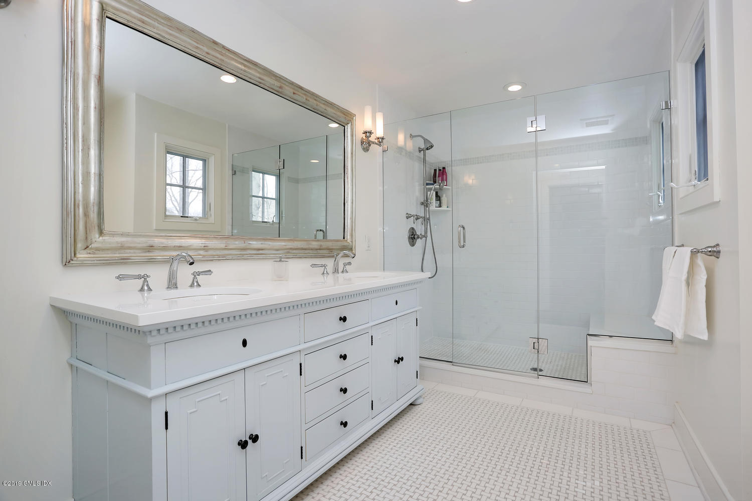 58 Indian Head Road Riverside, CT 06878 - Photo 21 of 33 a bathroom with a granite countertop sink mirror and double