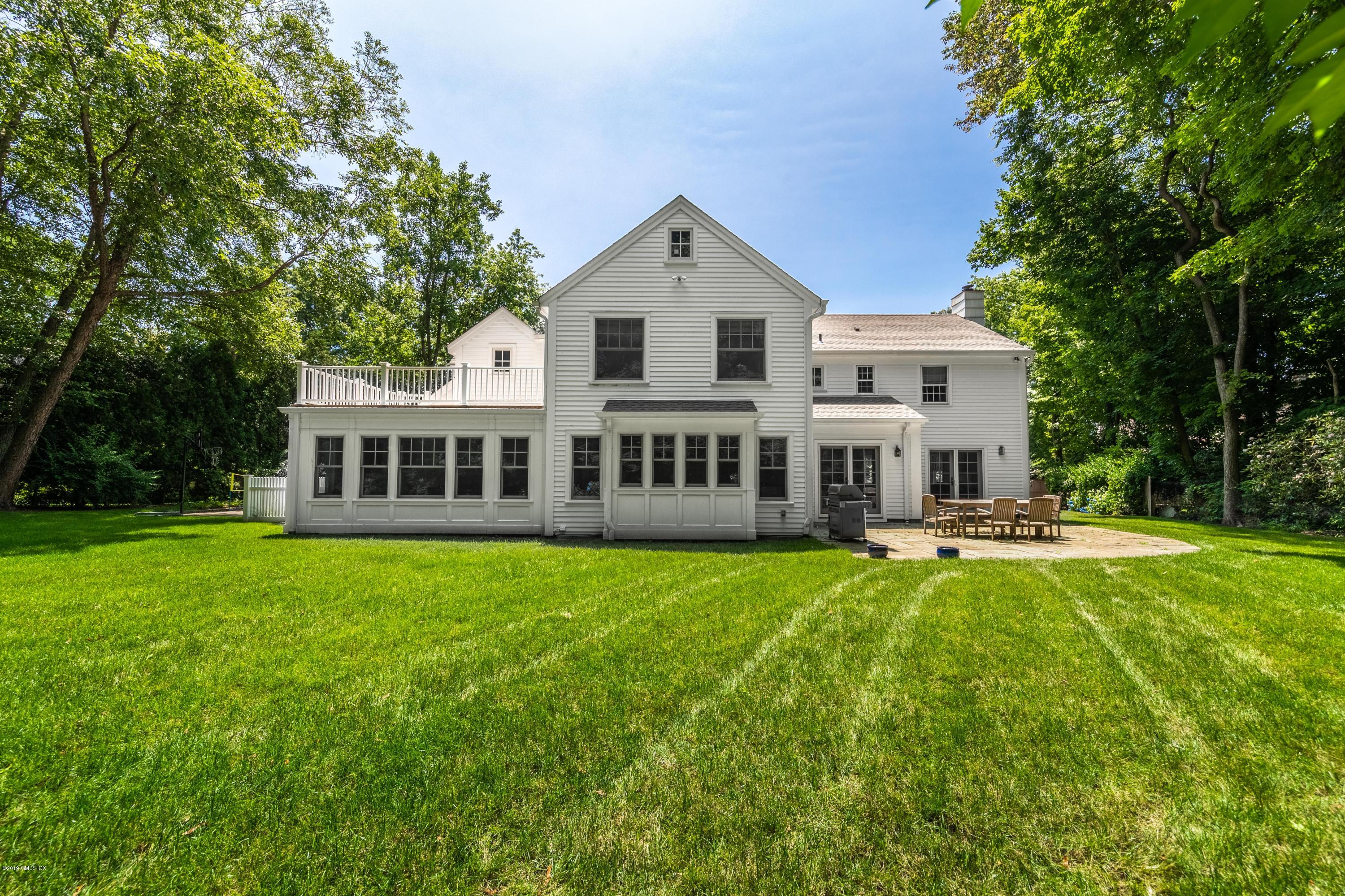 58 Indian Head Road Riverside, CT 06878 - Photo 27 of 33 a view of a house with a yard and sitting area