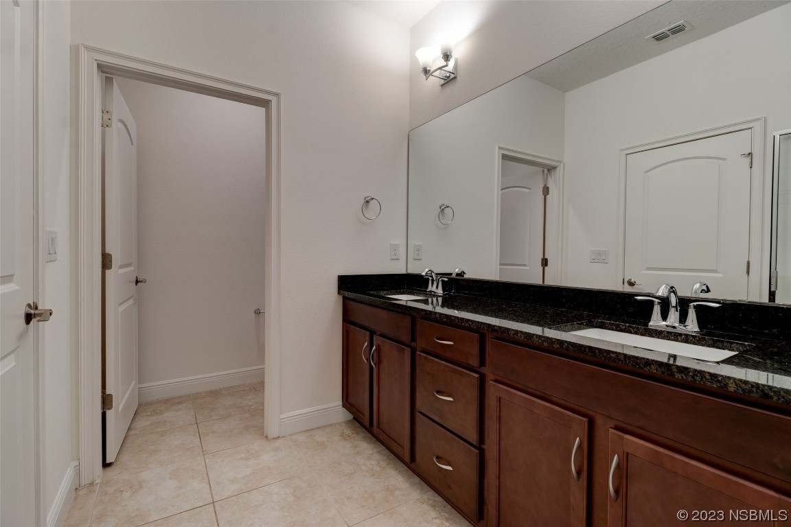5421 Estero Loop Port Orange, FL 32128 - Photo 21 of 30 a kitchen with a sink and cabinets
