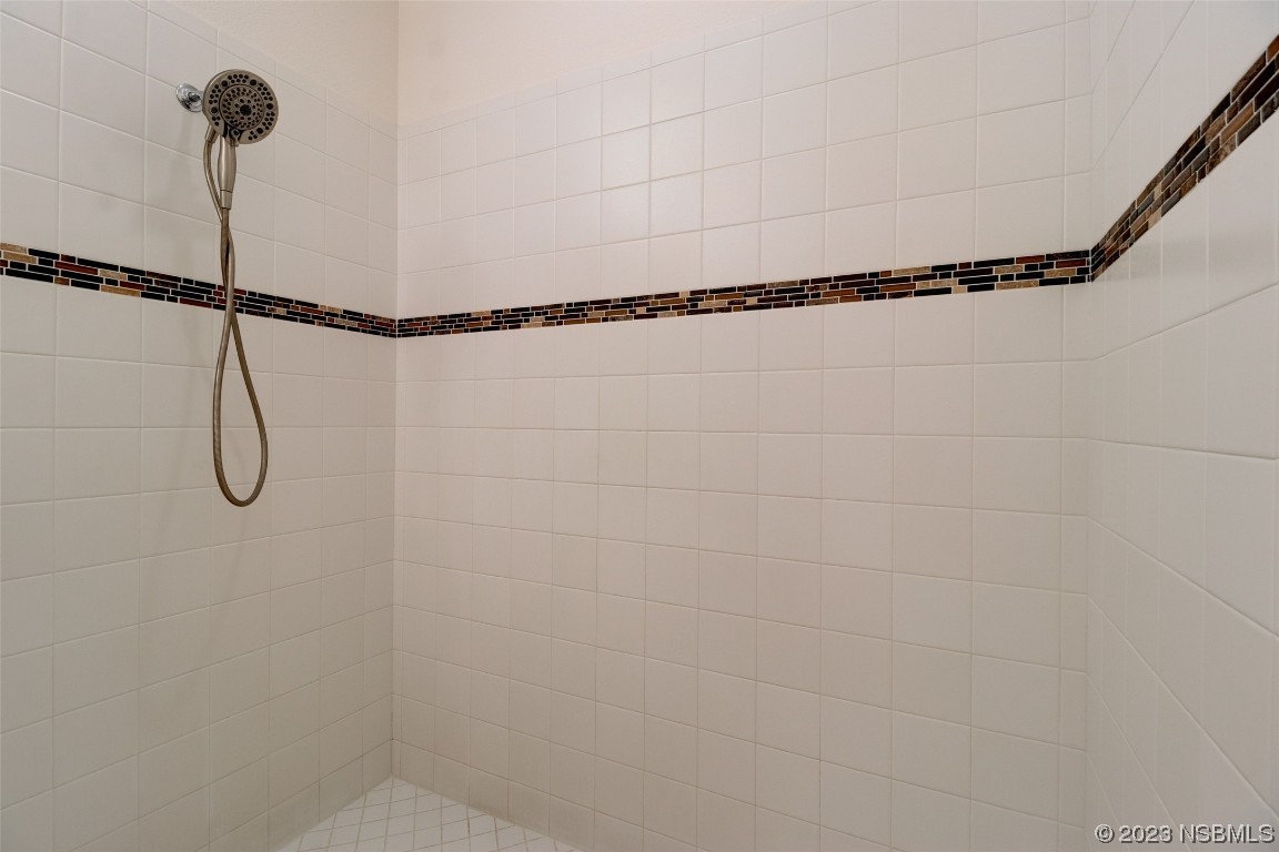 5421 Estero Loop Port Orange, FL 32128 - Photo 23 of 30 a bathroom with a shower
