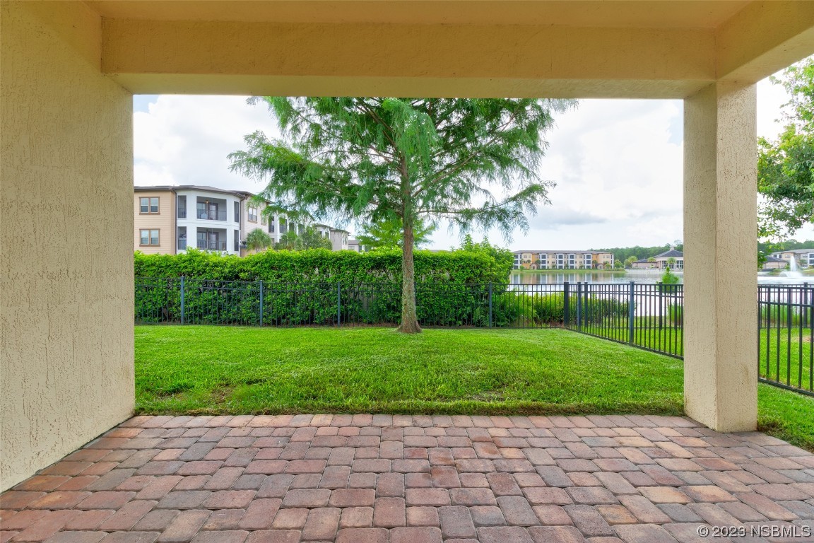 5421 Estero Loop Port Orange, FL 32128 - Photo 24 of 30 a view of a garden with a building in the background