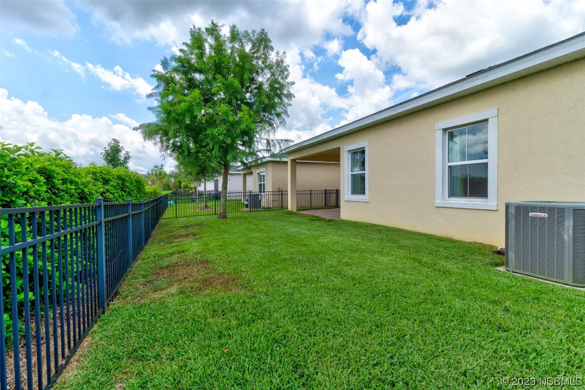 5421 Estero Loop Port Orange, FL 32128 - Photo 26 of 30 a view of a house with backyard and garden