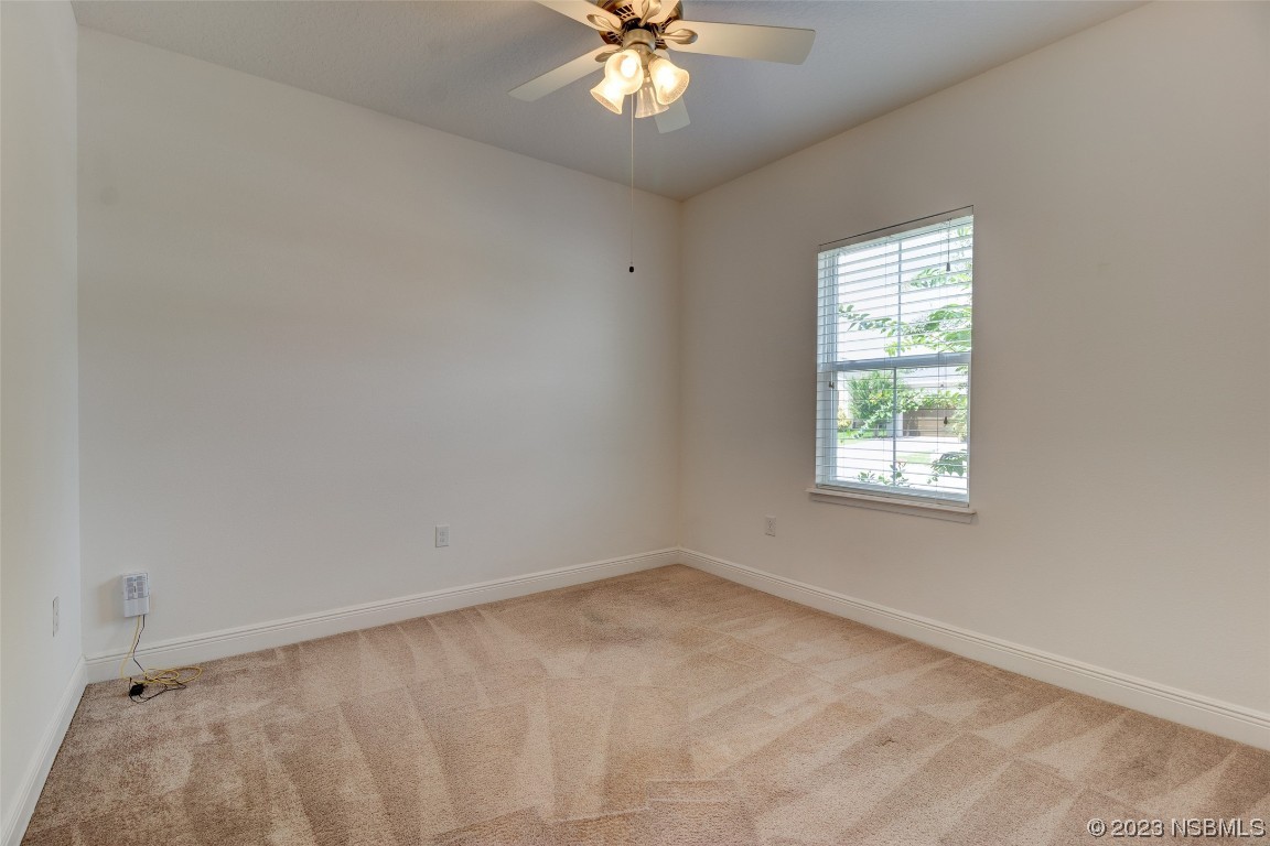 5421 Estero Loop Port Orange, FL 32128 - Photo 9 of 30 wooden floor in an empty room with a window