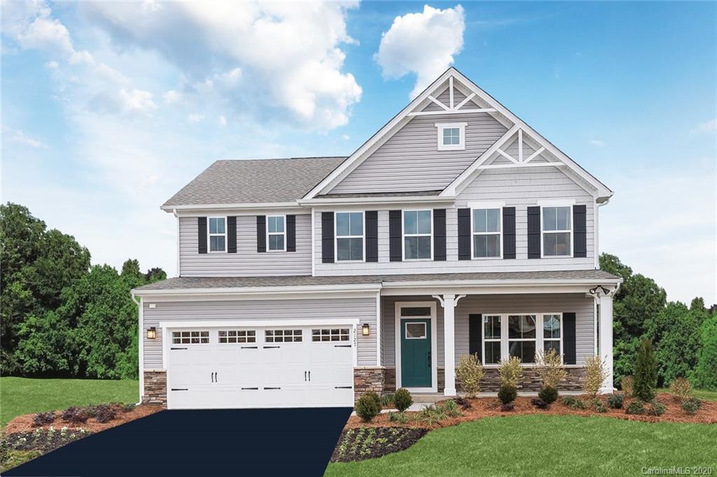 7080 Messina Road, Unit 142 Indian Land, SC 29707 - Photo 1 of 7 a front view of a house with a yard
