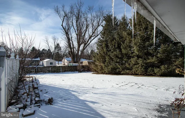 a view of side of snow with yard