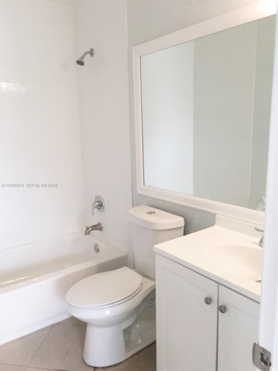 4581 West McNab Road, Unit 17 Pompano Beach, FL 33069 - Photo 11 of 12 a bathroom with a sink and a toilet