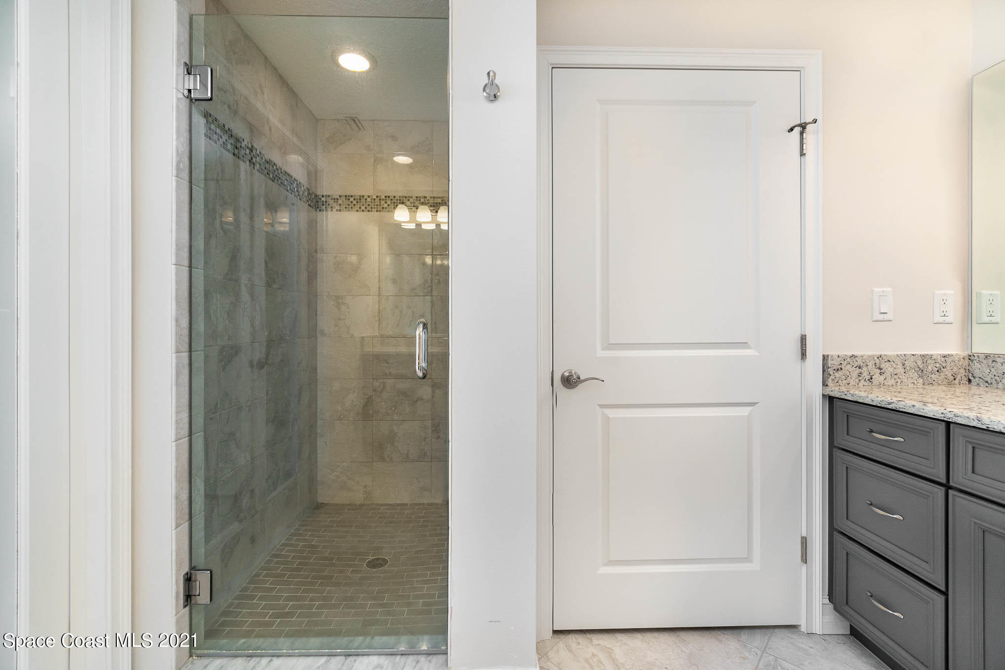1045 Florida A1A, Unit 503 Satellite Beach, FL 32937 - Photo 15 of 23 a bathroom with a shower and a sink