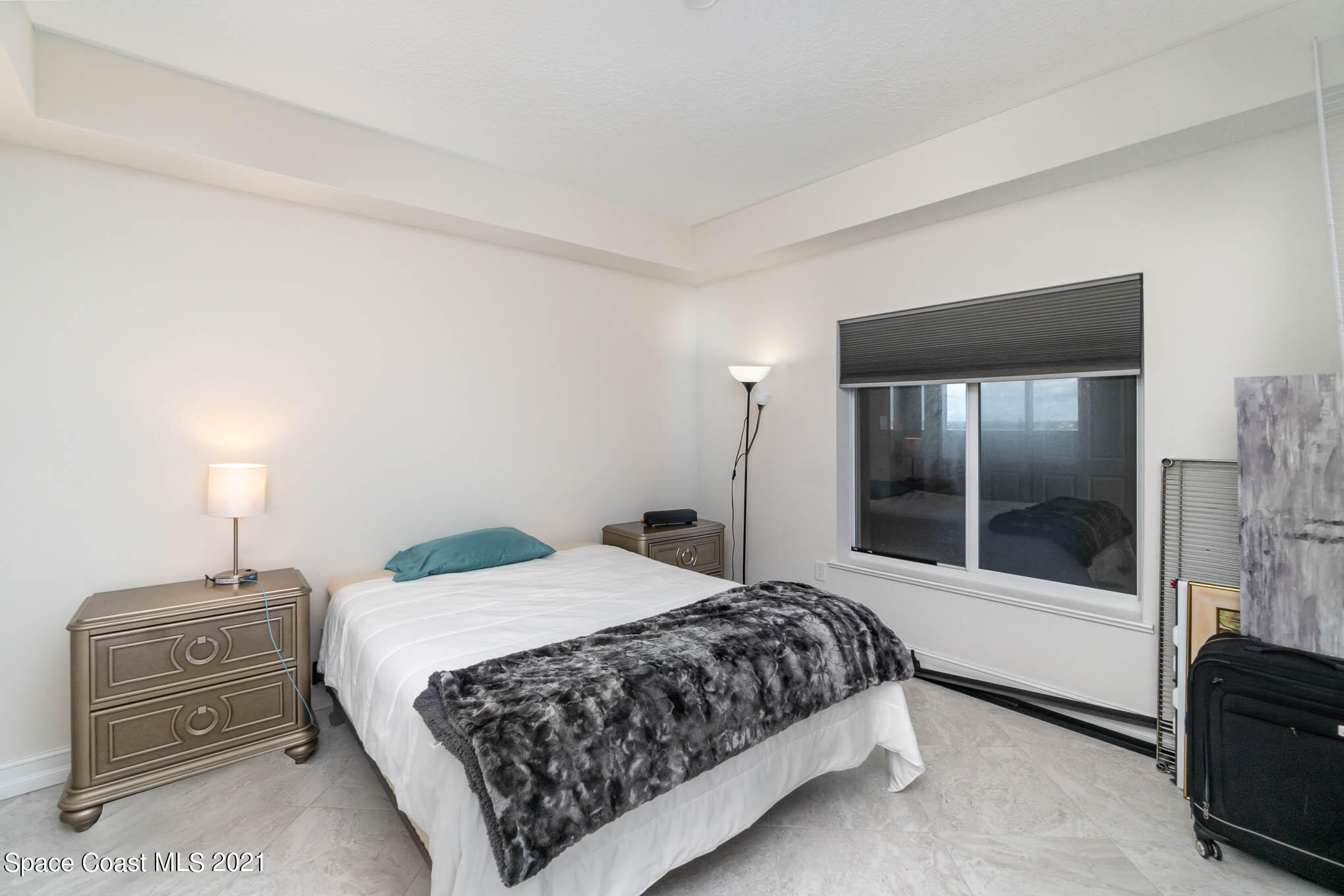 1045 Florida A1A, Unit 503 Satellite Beach, FL 32937 - Photo 16 of 23 a bedroom with a bed and a view of bedroom