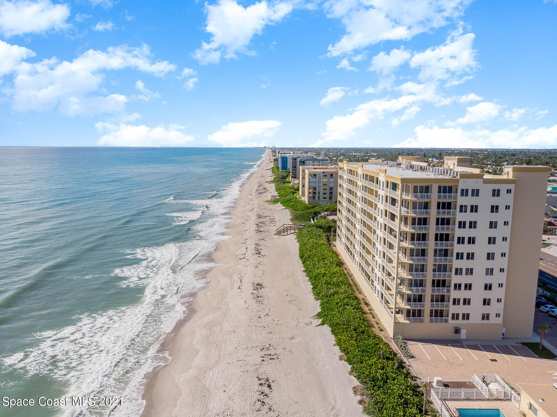 1045 Florida A1A, Unit 503 Satellite Beach, FL 32937 - Photo 3 of 23 a view of a city with an ocean view