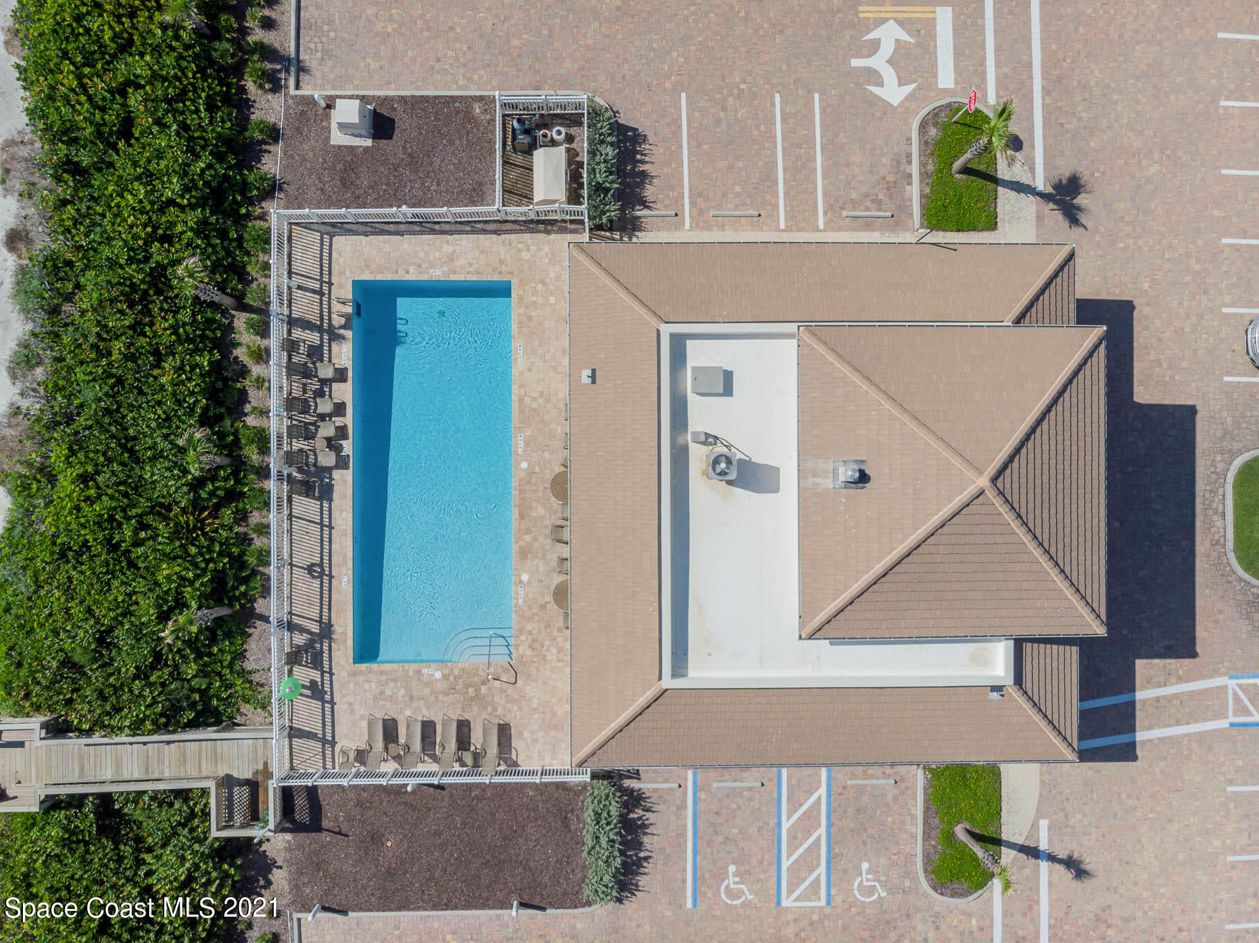 1045 Florida A1A, Unit 503 Satellite Beach, FL 32937 - Photo 4 of 23 an aerial view of a house with a swimming pool