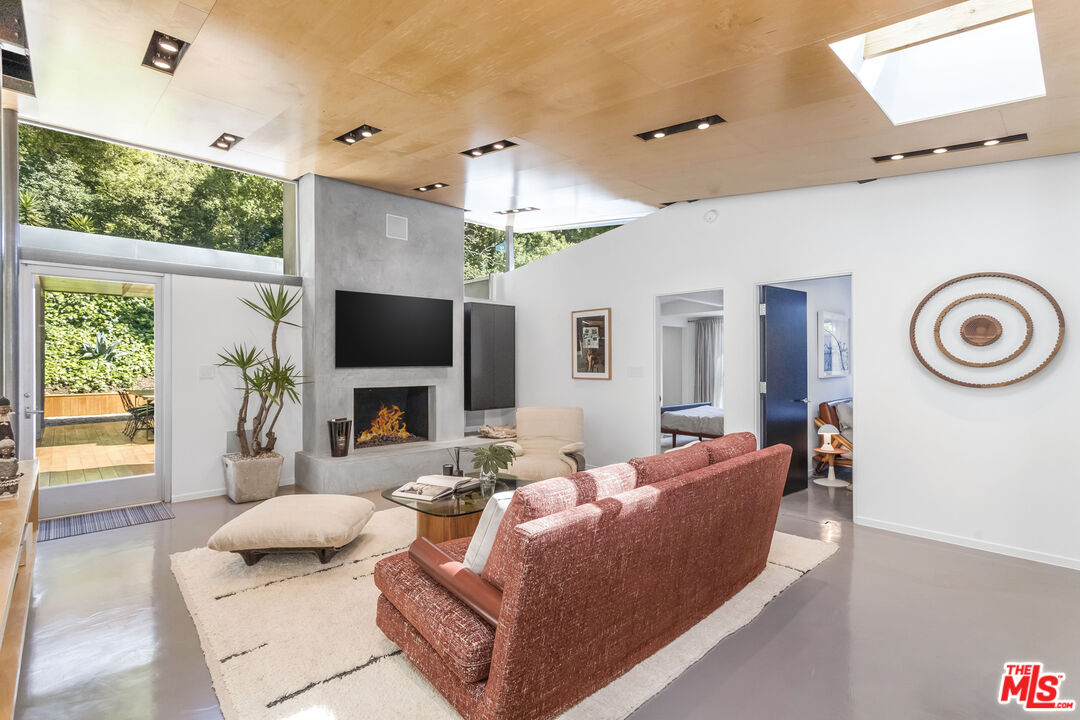 2538 Hutton Drive Beverly Hills, CA 90210 - Photo 14 of 63 a living room with furniture and a flat screen tv
