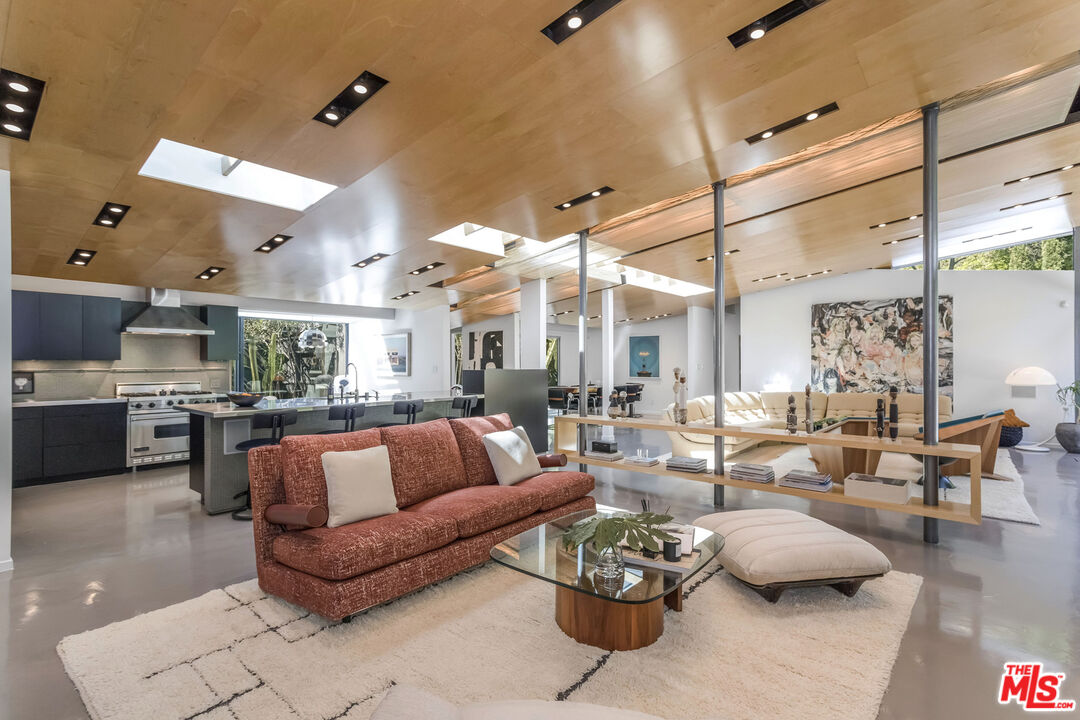 2538 Hutton Drive Beverly Hills, CA 90210 - Photo 16 of 63 a living room with furniture and a large window
