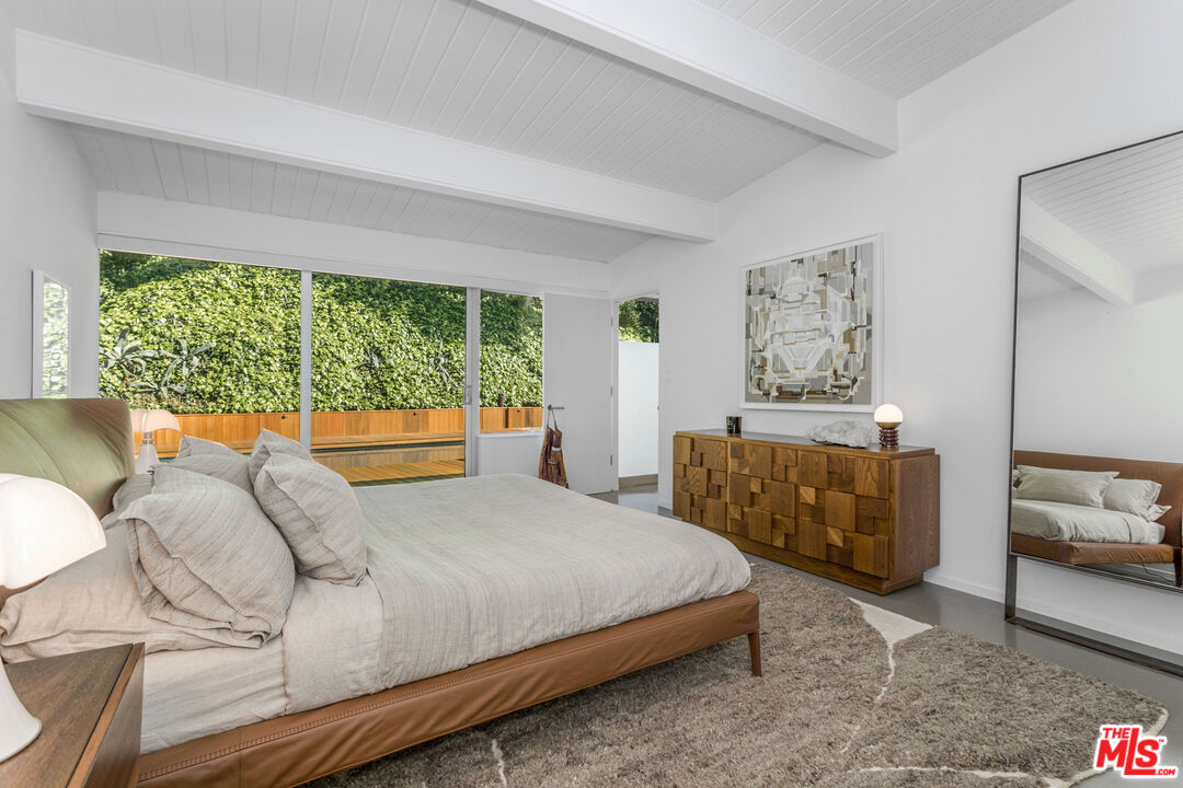 2538 Hutton Drive Beverly Hills, CA 90210 - Photo 28 of 63 a bedroom with a bed and a couch