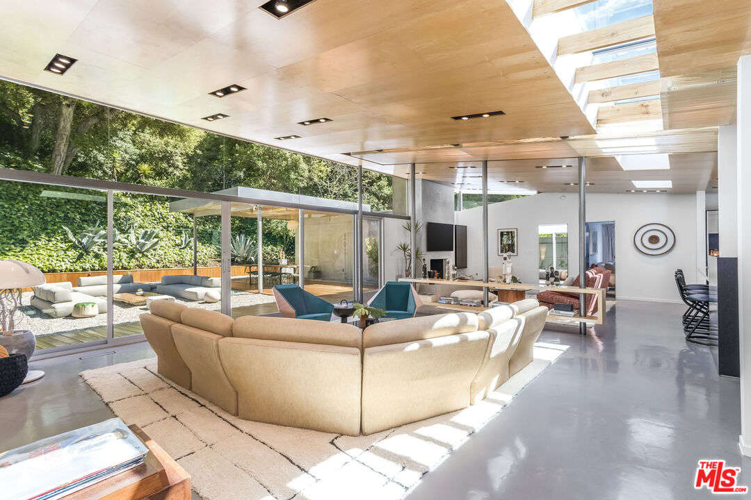 2538 Hutton Drive Beverly Hills, CA 90210 - Photo 8 of 63 a living room with furniture and a large window
