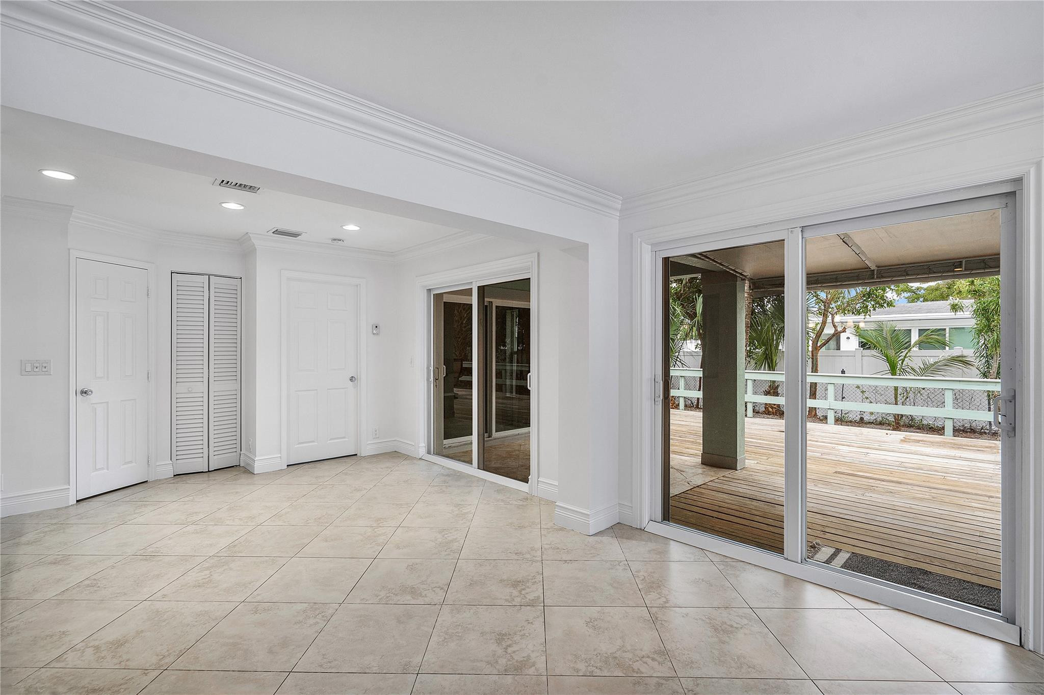 290 Northeast 29th Street Boca Raton, FL 33431 - Photo 14 of 48 a view of an empty room with glass door