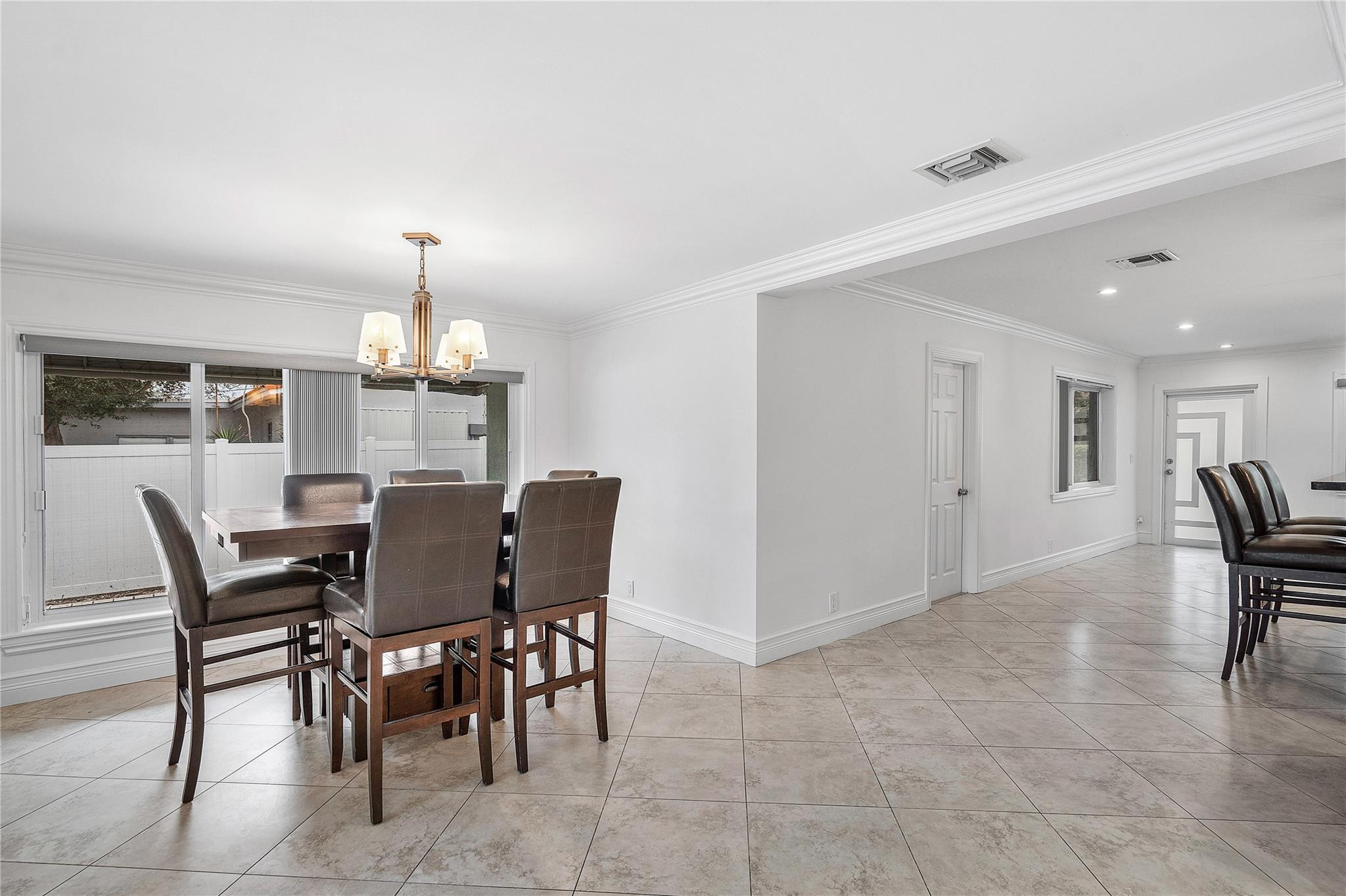 290 Northeast 29th Street Boca Raton, FL 33431 - Photo 16 of 48 a view of a dining room with furniture