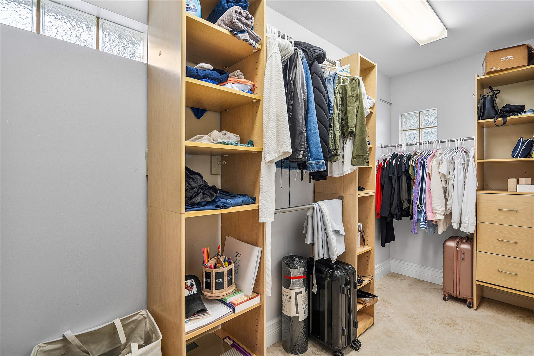 290 Northeast 29th Street Boca Raton, FL 33431 - Photo 21 of 48 a view of walk in closet with clothes and shoes