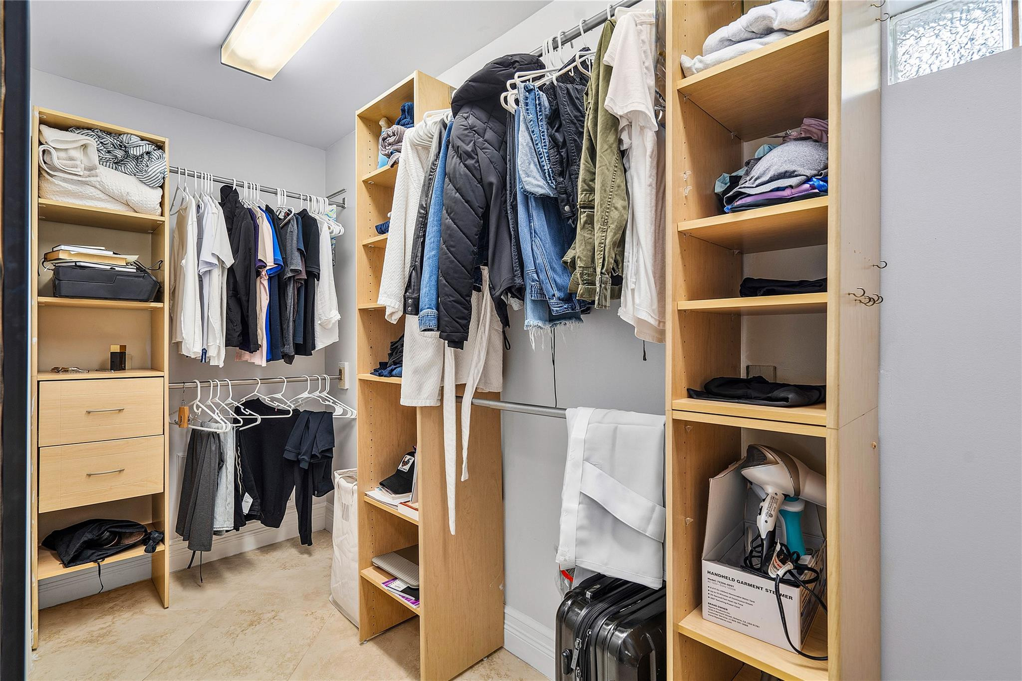 290 Northeast 29th Street Boca Raton, FL 33431 - Photo 22 of 48 a view of walk in closet with clothes and shoes